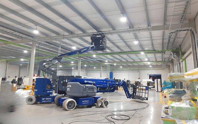 Access equipment working under the overhead crane.