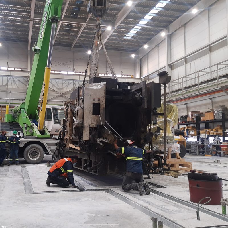 Machine lowered onto its foundation by crane.