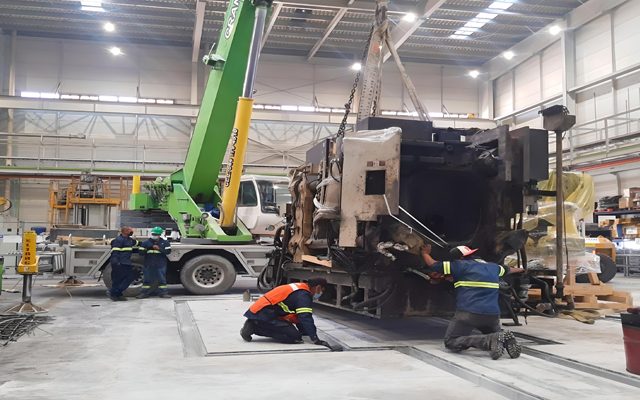 Machine lowered into position by crane.