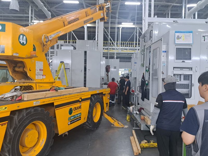 Installed row of machining cells awaiting utility connection.
