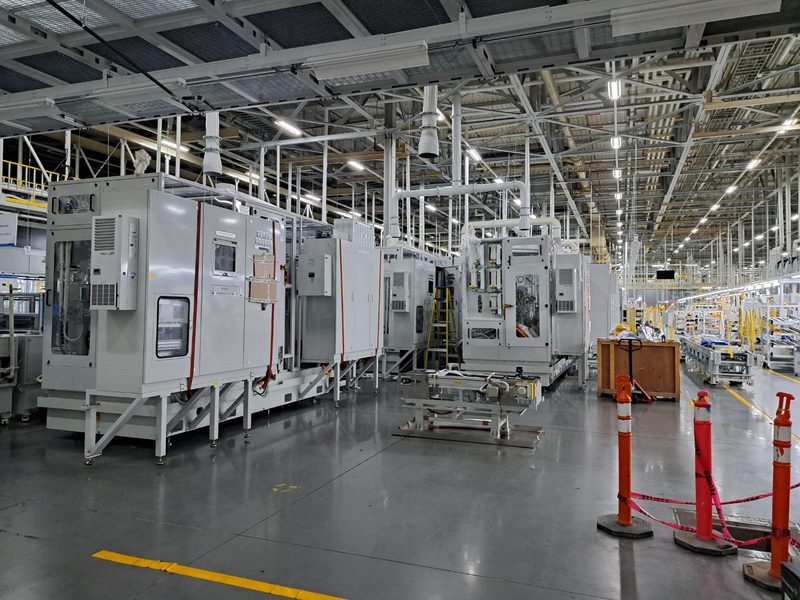Machines set and aligned along the new line.