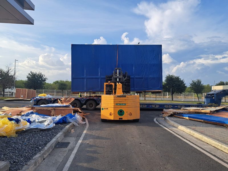 Wrapped equipment off-loaded from the trailer on arrival.