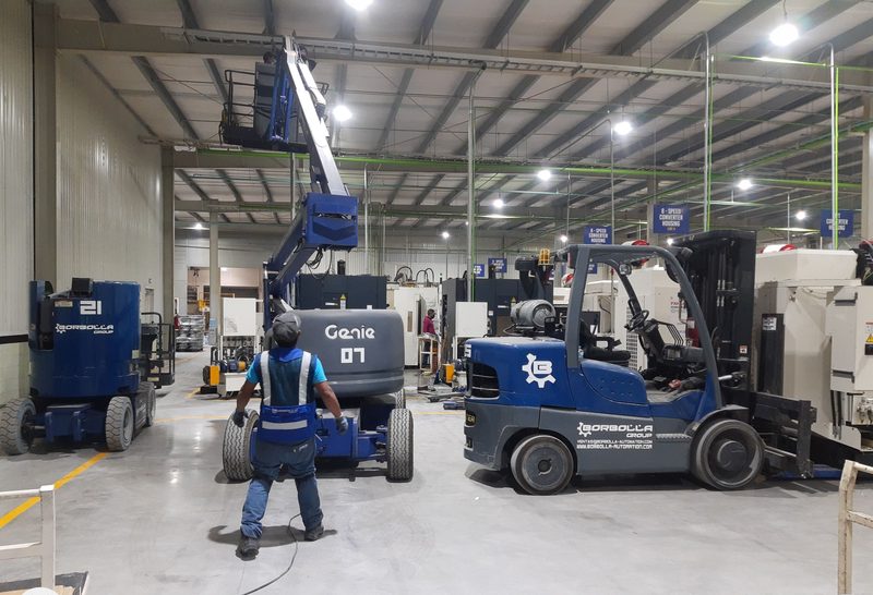 FANUC Robodrill and MAKINO machines being positioned on the converter housing line.